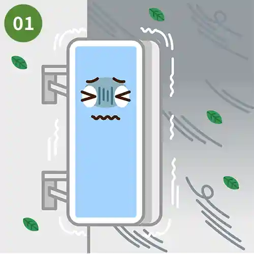 台風が直撃し、揺れる看板